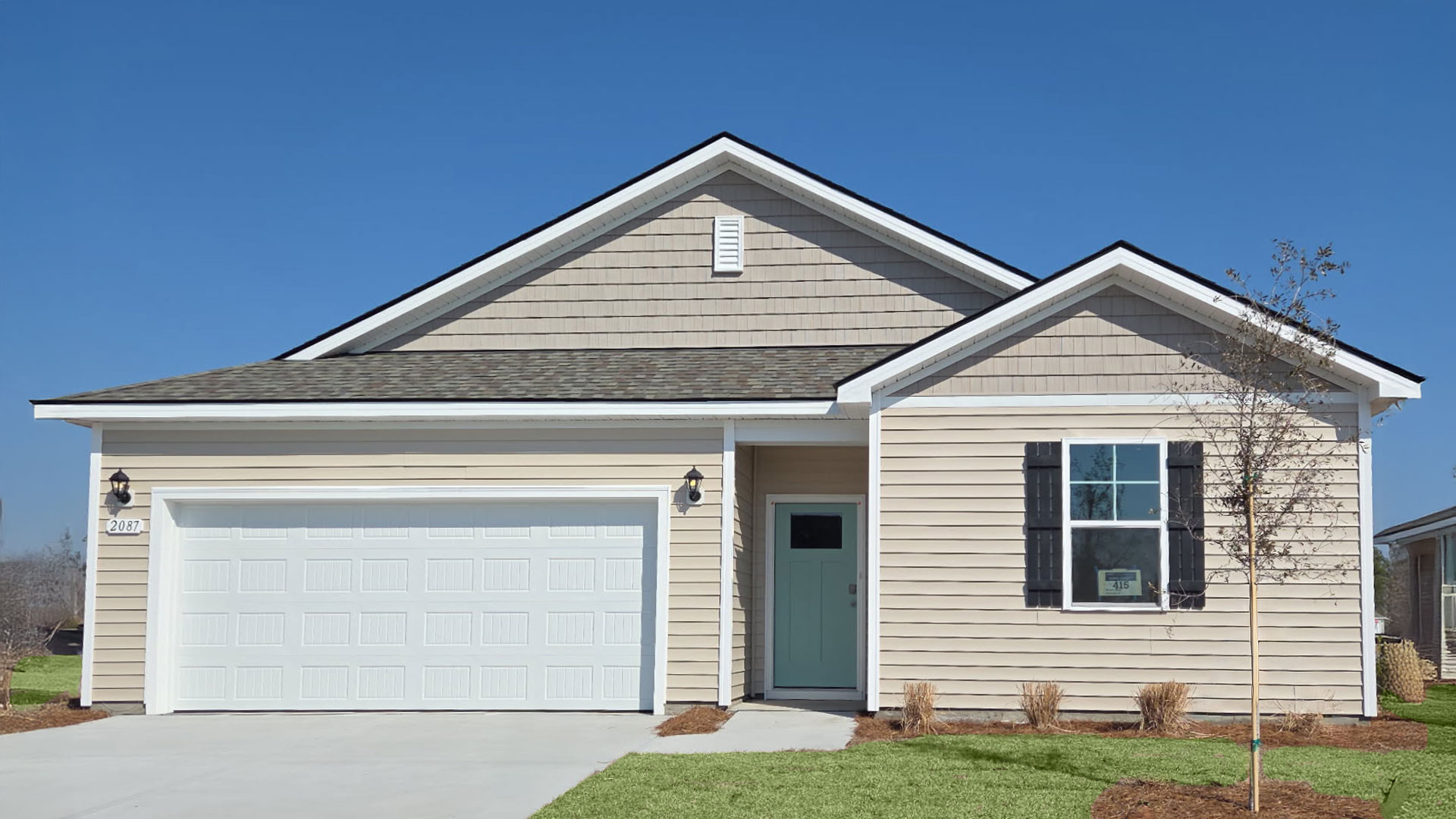 Single-story home with siding