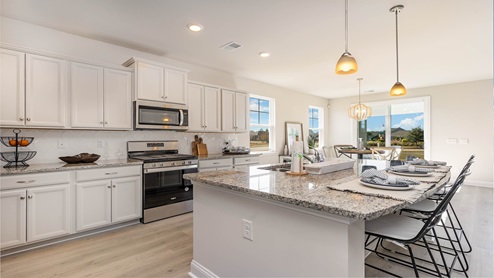 kitchen with cream cabinets and granite countertops
