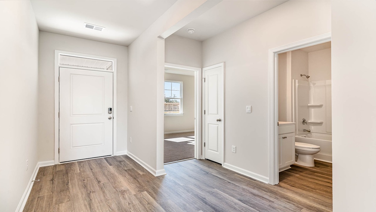 entryway with white door