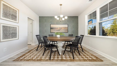 Dining area with wall paper
