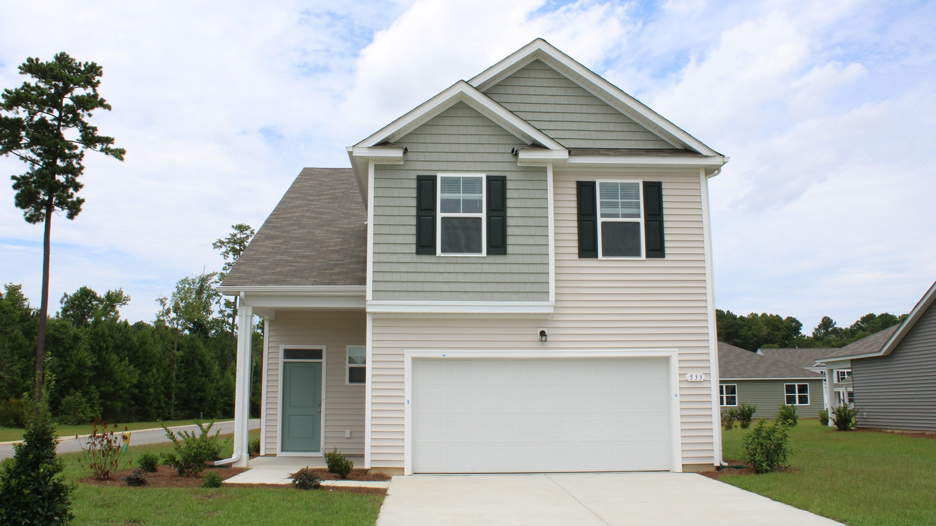 tow story home with vinyl siding