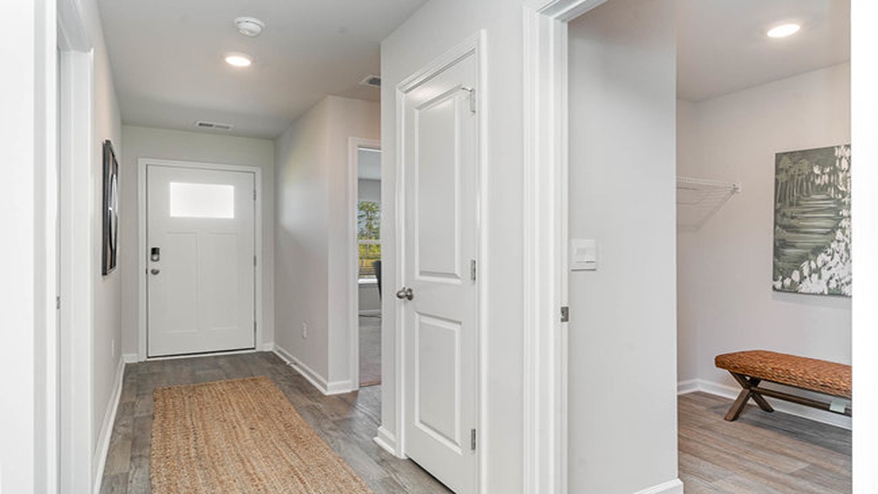 entryway with white door