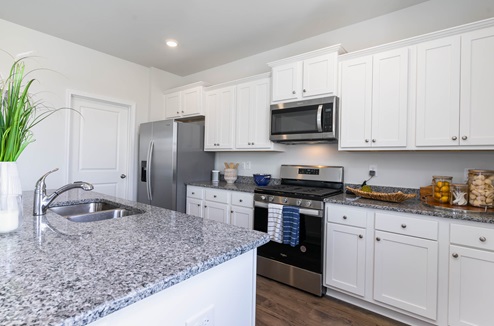 Galen Kitchen with white cabinets and granite countertops
