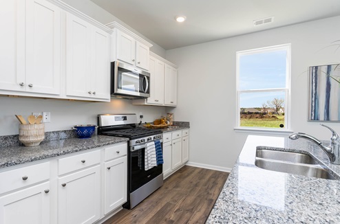 Galen Kitchen with white cabinets and granite countertops
