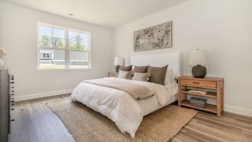 primary bedroom with luxury vinyl floor