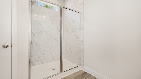 Primary bath with walk-in shower with stone