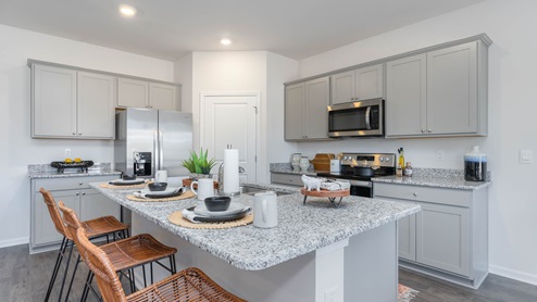 kitchen with gray cabinets and granite counter tops