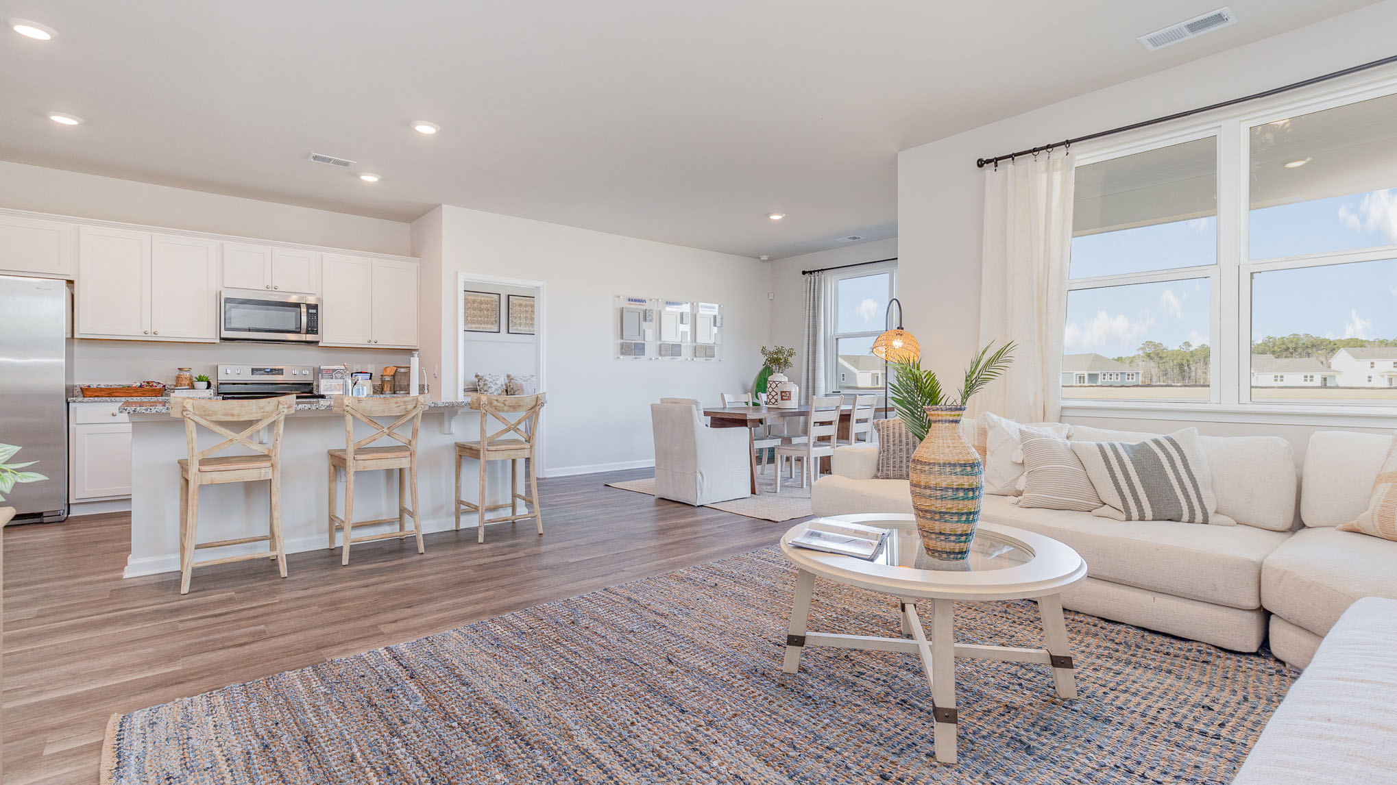 aria living room with kitchen overview