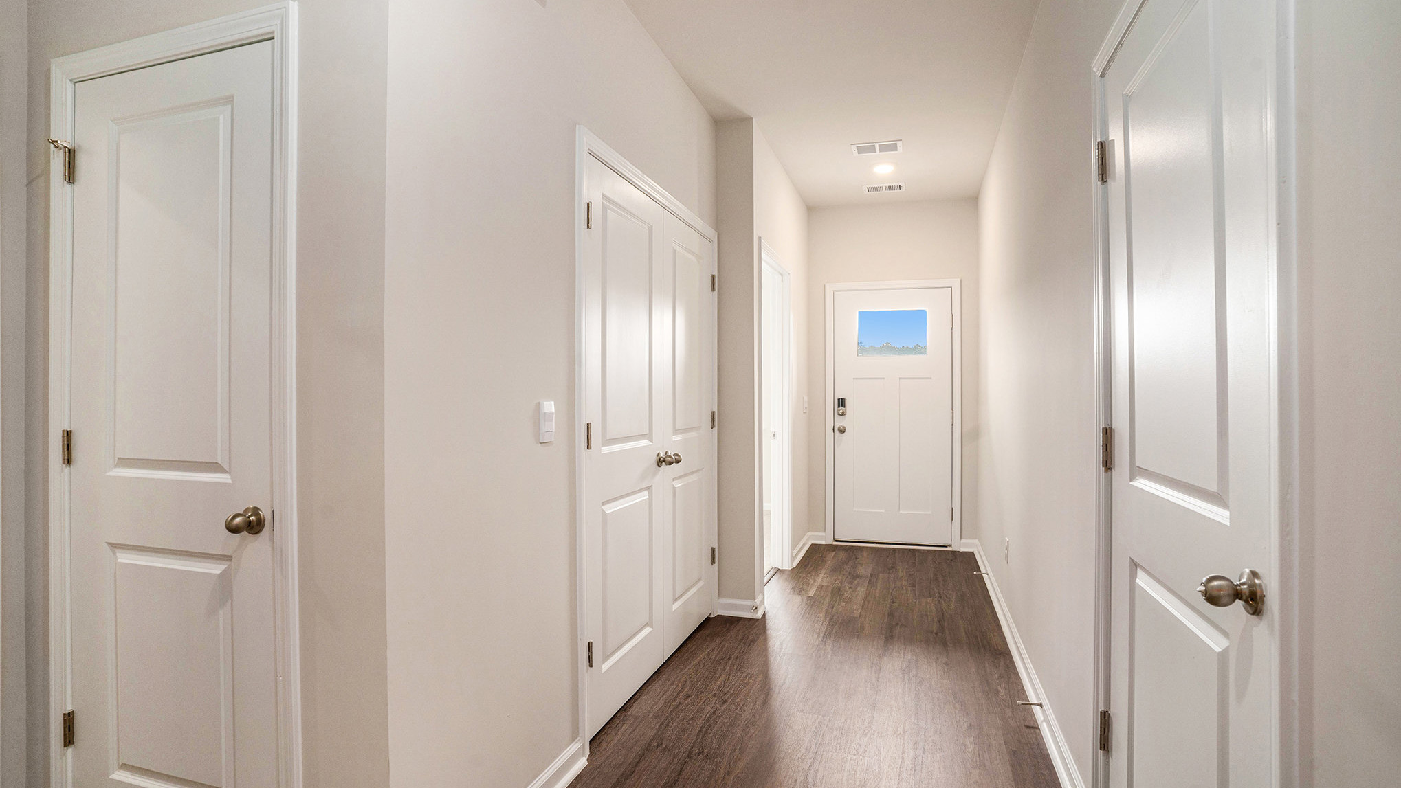 entryway with white door