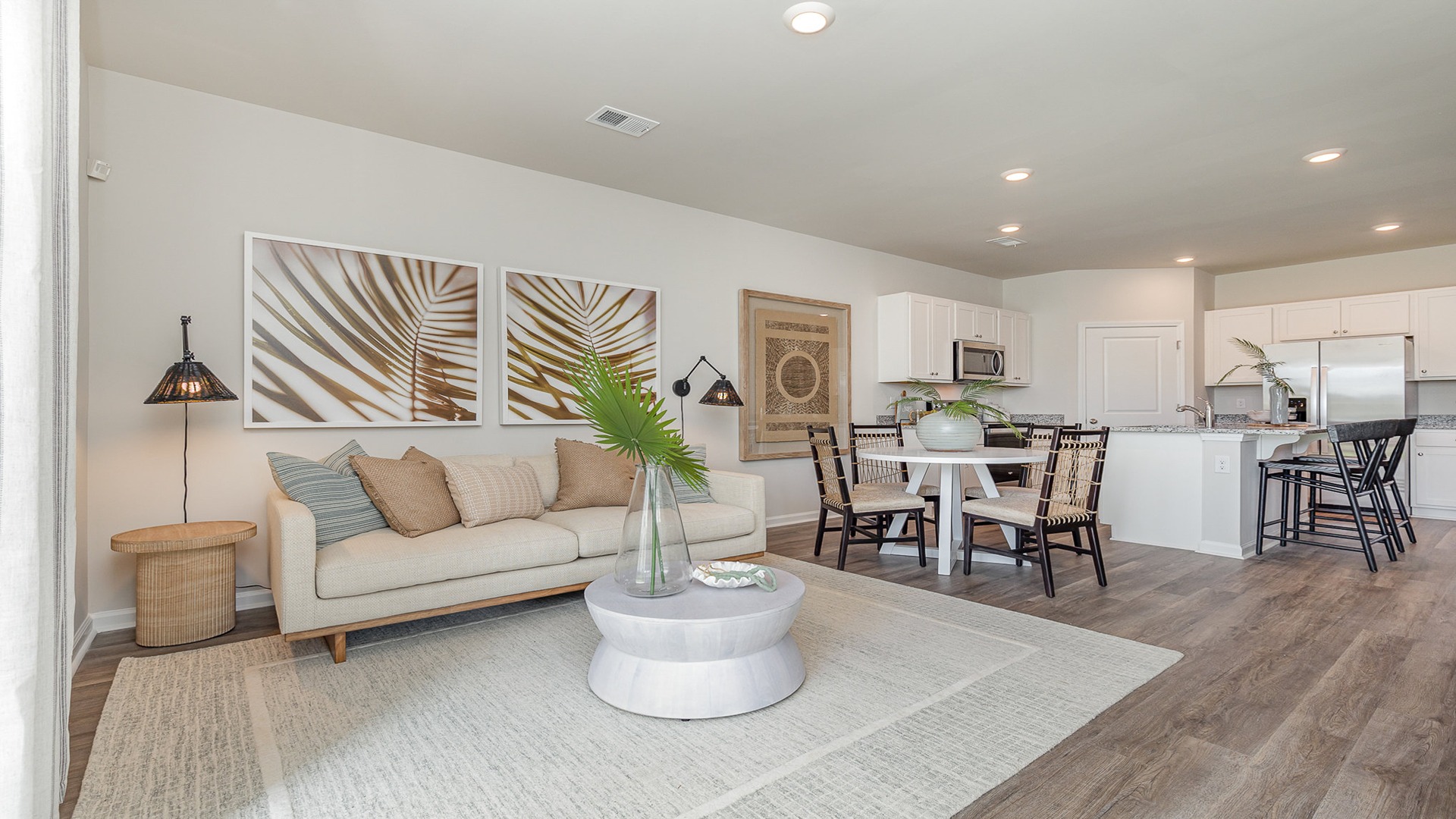 Belmont overview of living room with kitchen in view and dining table