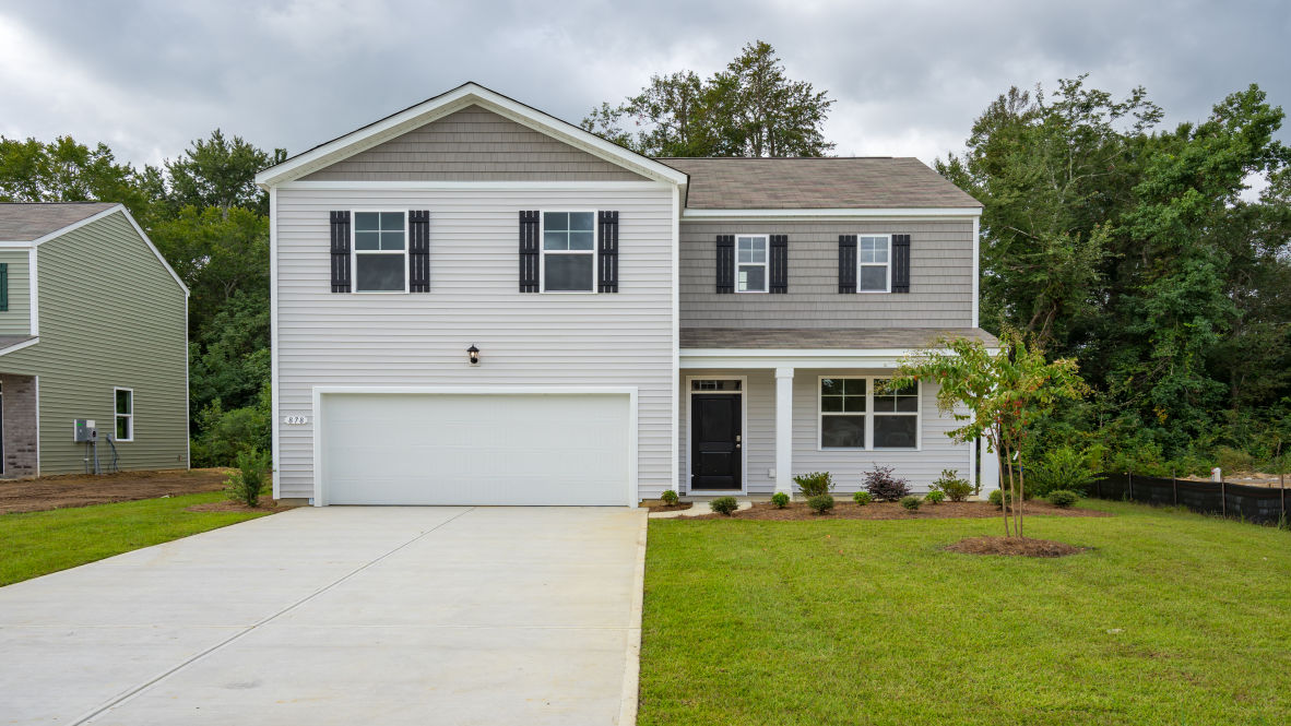two story home with vinyl sididng