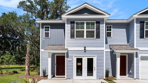 Two-story townhome with blue siding