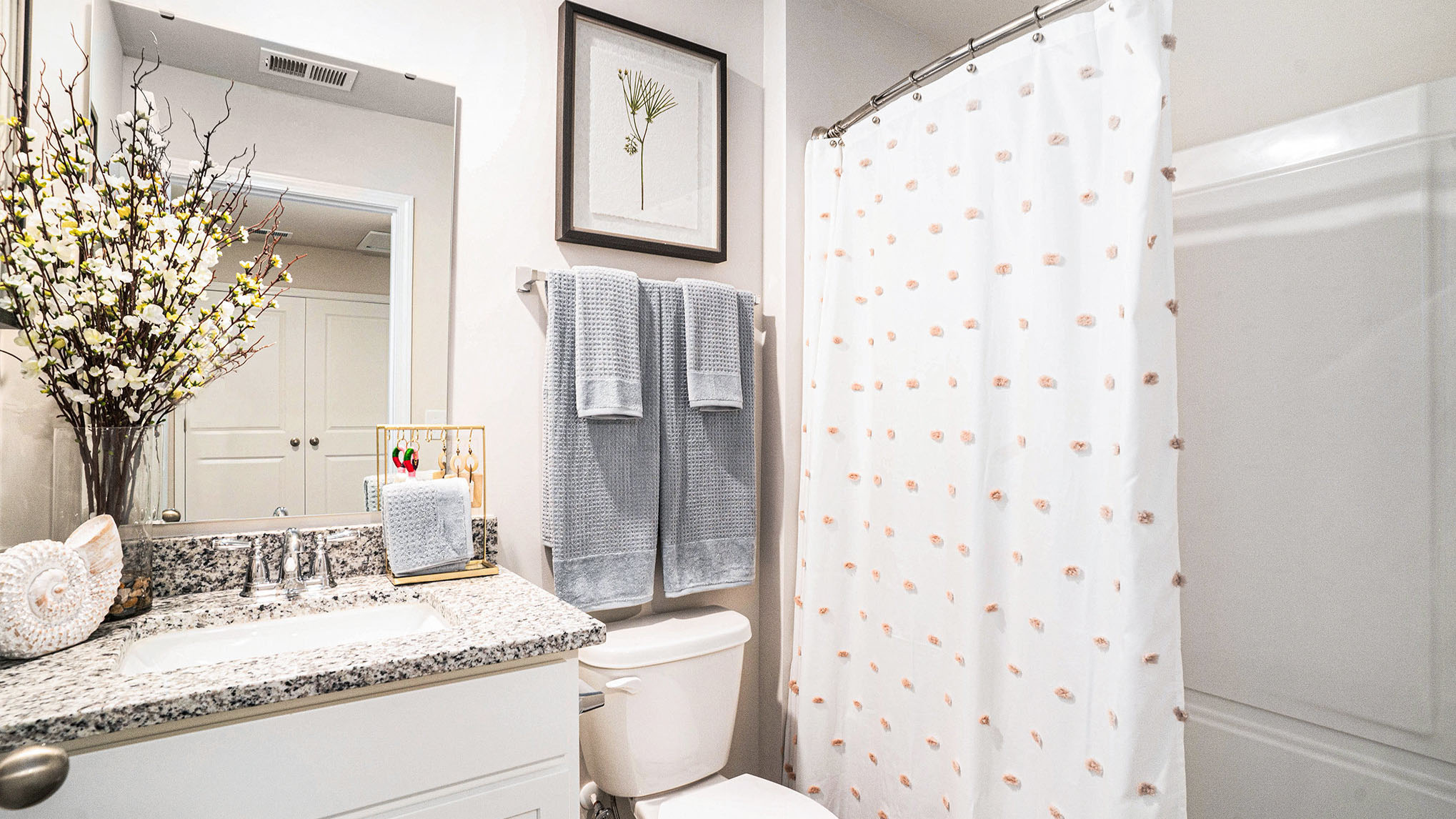 bathroom with quartz counters