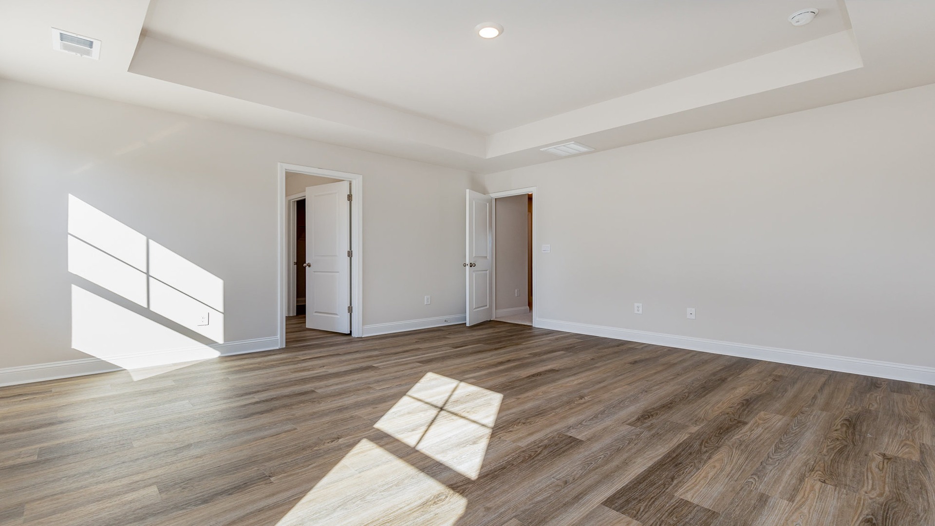 Forrester primary bedroom with door