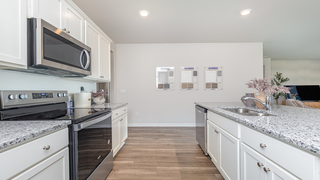 kitchen with white cabinets and granite countertops
