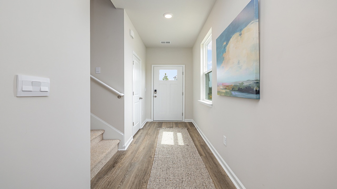 foyer with vinyl plank flooring