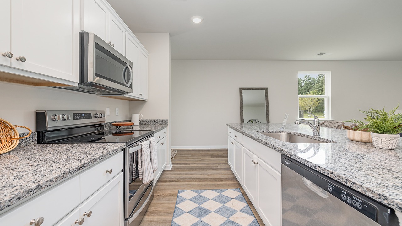 kitchen with white cabinets and granite countertops