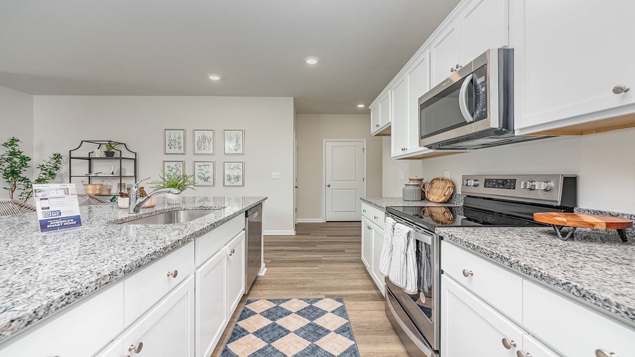 kitchen with white cabinets and granite countertops