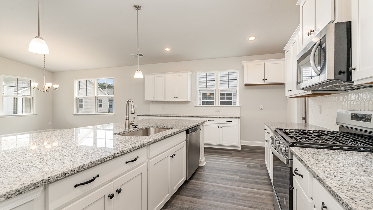 kitchen with white cabinets and granite countertops