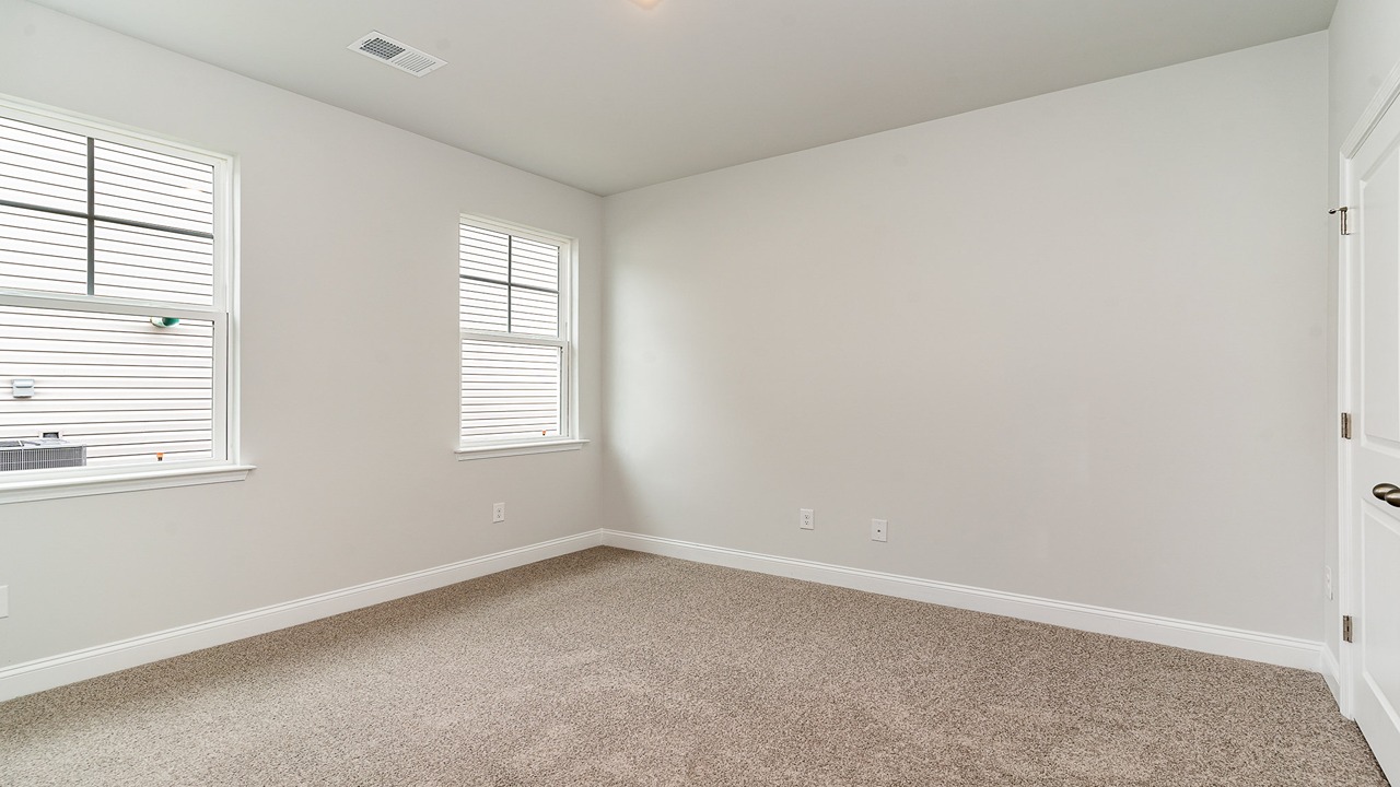 second bedroom with carpet