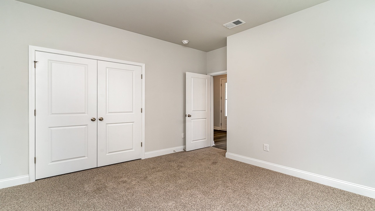 second bedroom with carpet