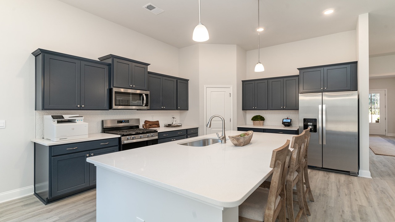 kitchen with navy cabinets and granite countertops