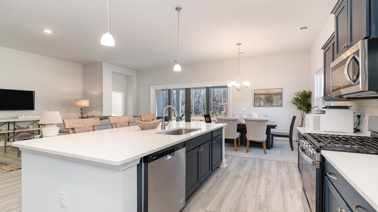 kitchen with navy cabinets and granite countertops