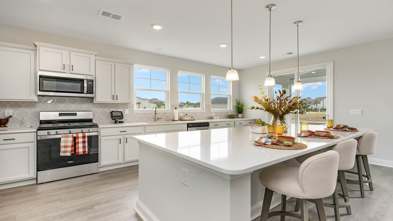 kitchen with gray cabinets and granite countertops
