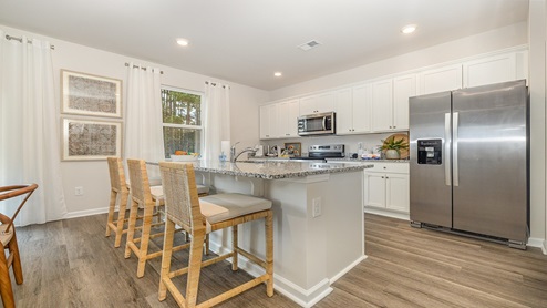 Galen kitchen with granite countertop and stainless steel appliances
