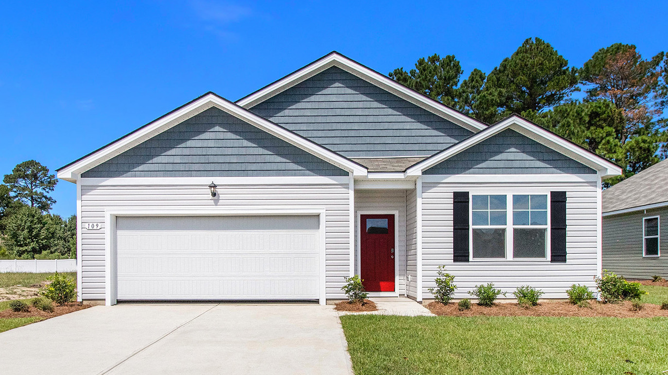 single story home with red door