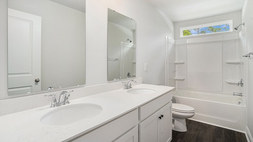 bathroom with quartz counters
