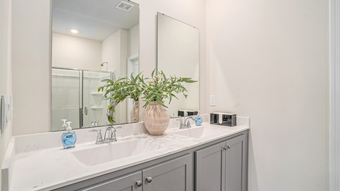 bathroom with quartz counters