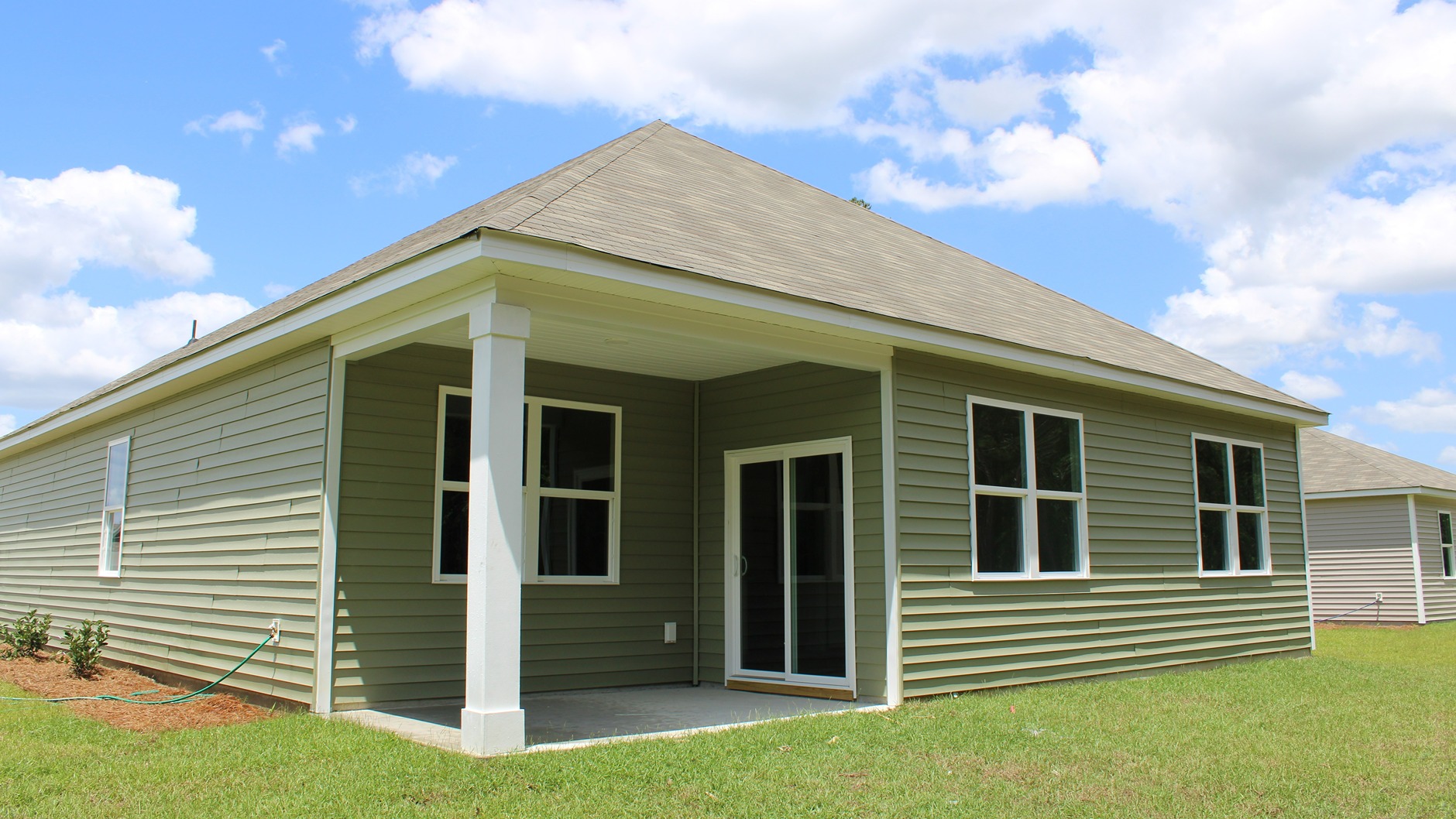 Single-story home rear with covered porch