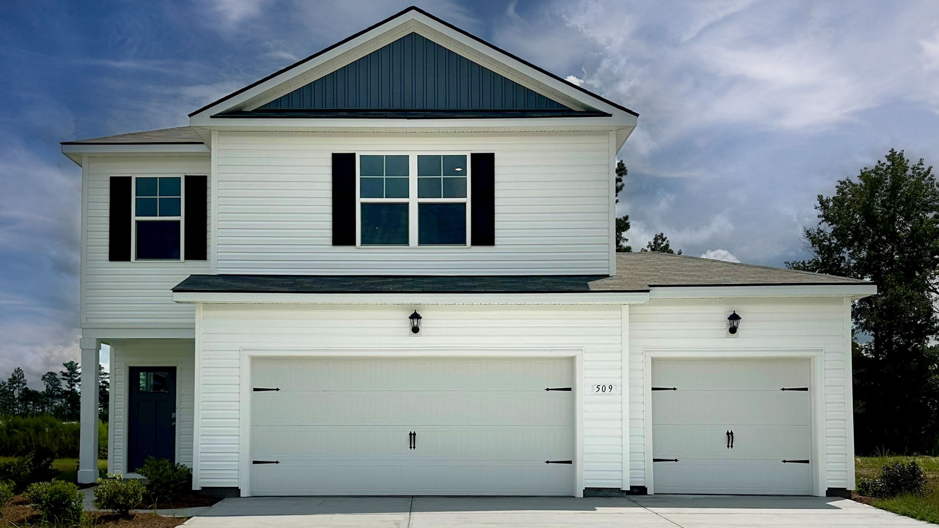 two story home with three car garage