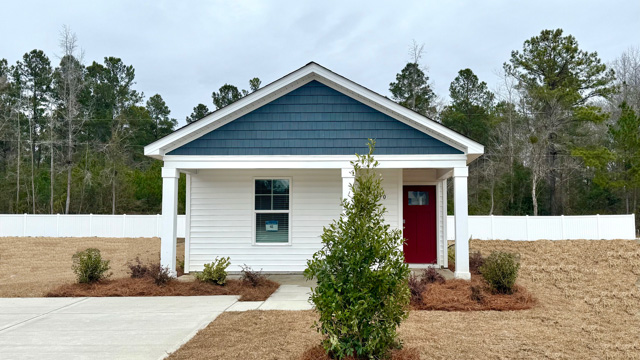 Single-story home with red door