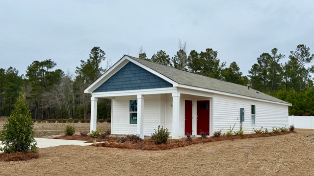 Single-story home with red door