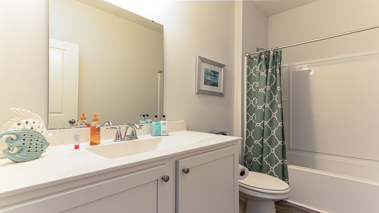 bathroom with quartz counters