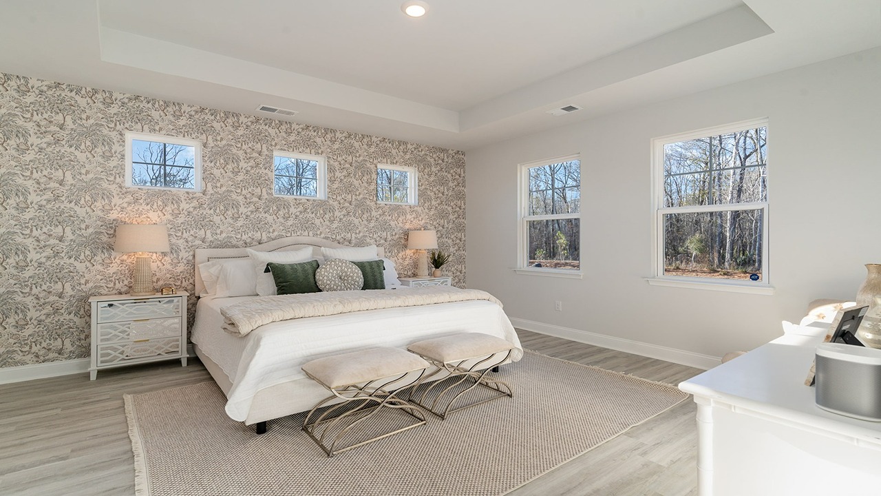 primary bedroom with tray ceilings