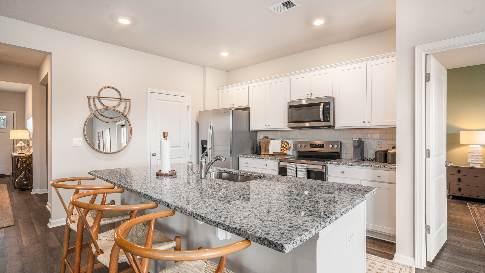 kitchen with white cabinets and granite