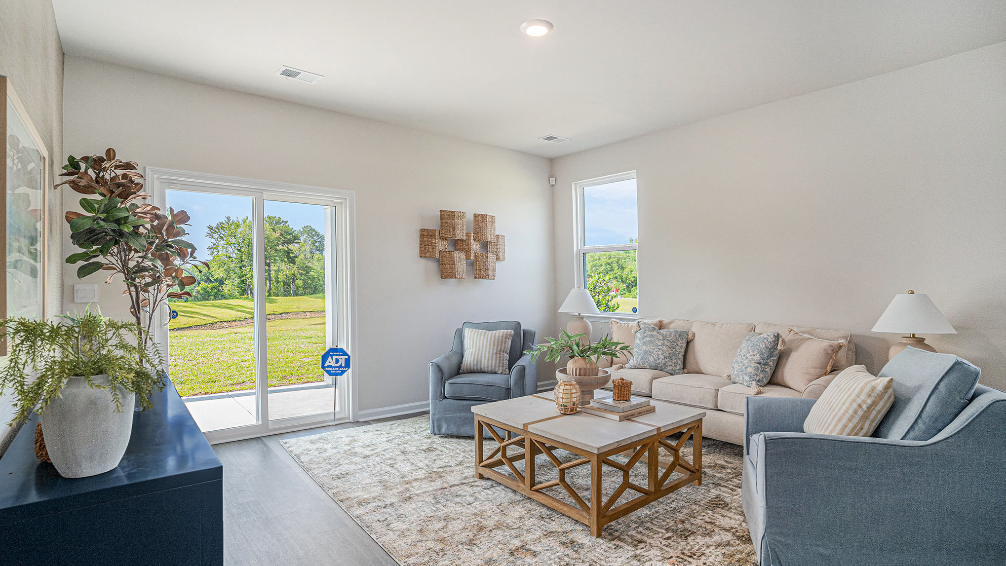 Manning livign room with blue couch