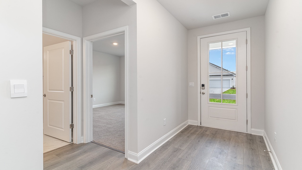 entryway with white door