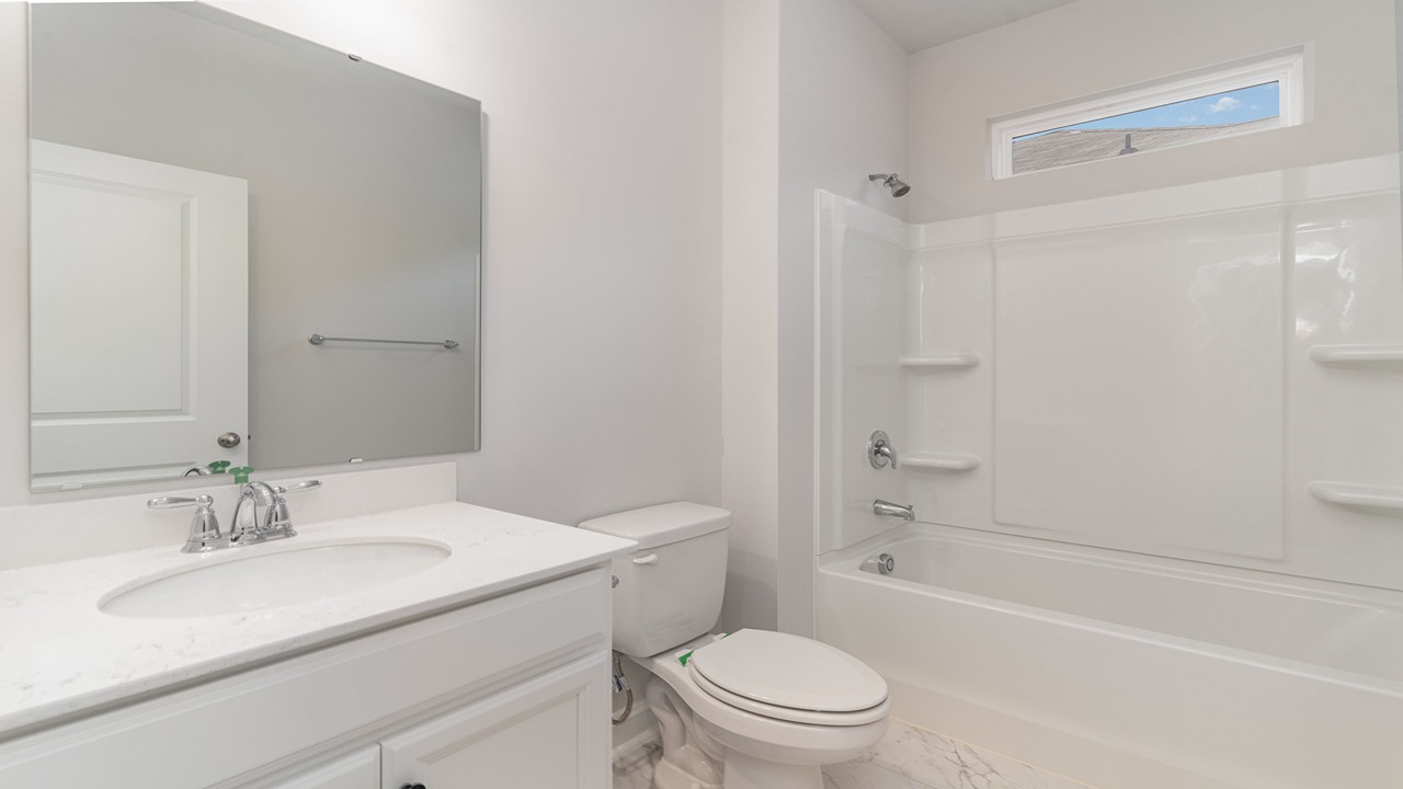 bathroom with quartz counters