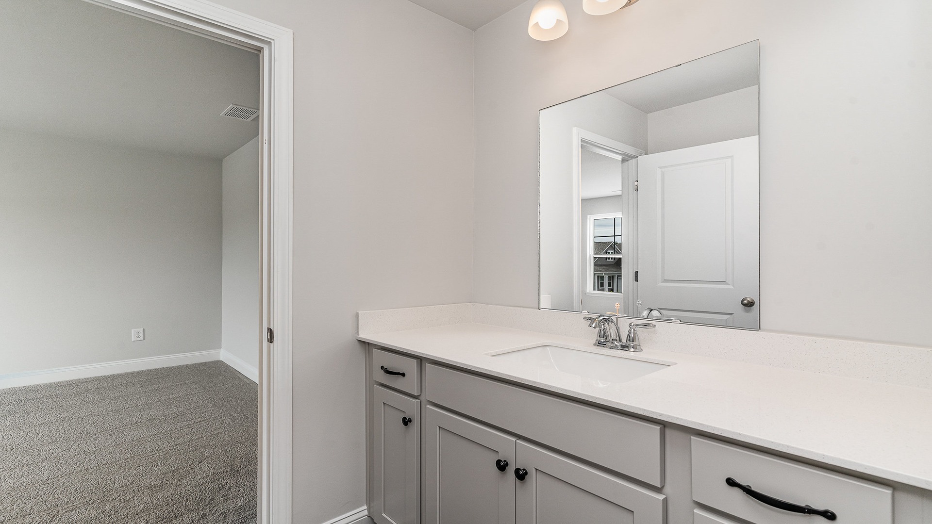 bathroom with quartz counters
