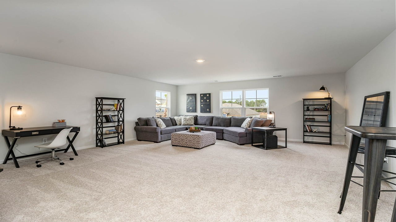 loft area with carpet flooring