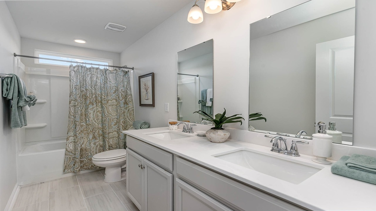 bathroom with quartz counters