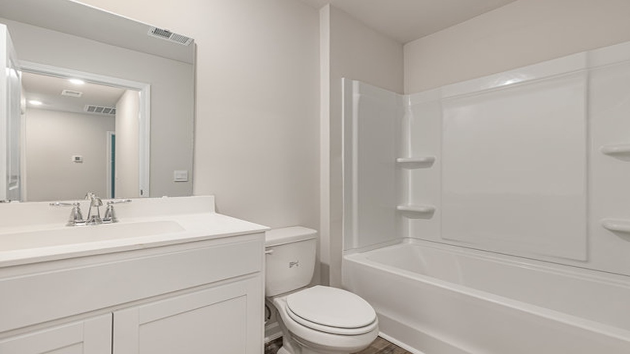bathroom with quartz counters