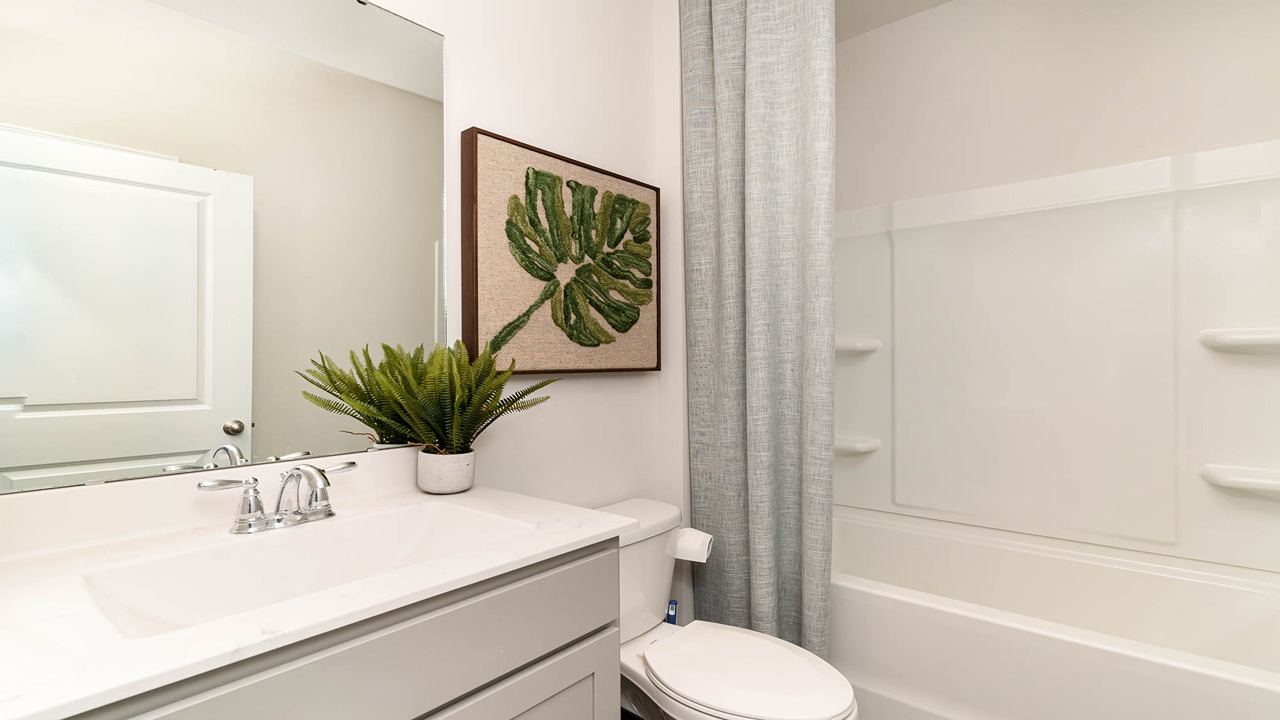 bathroom with quartz cvounters