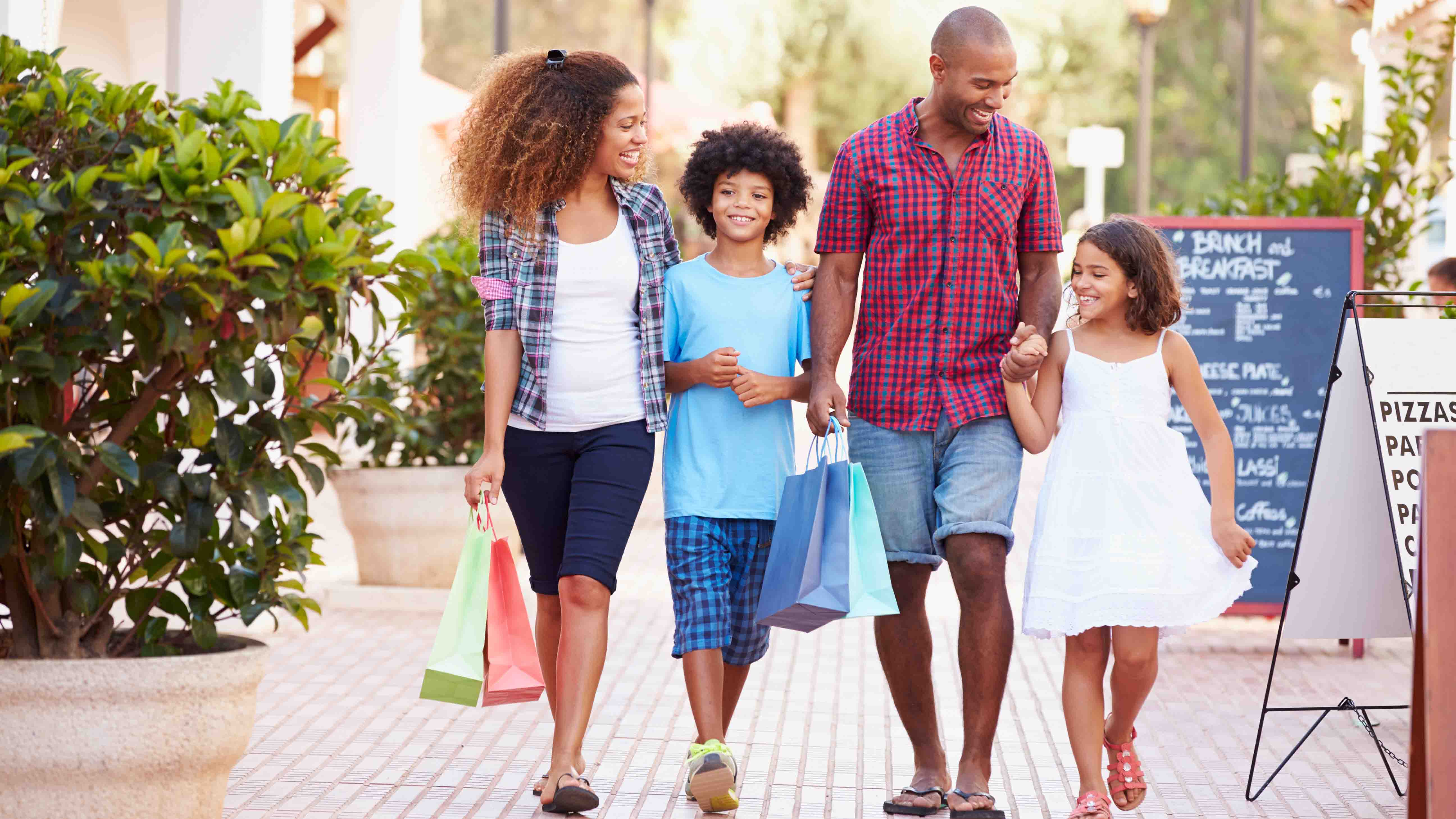 family walking downtown shopping