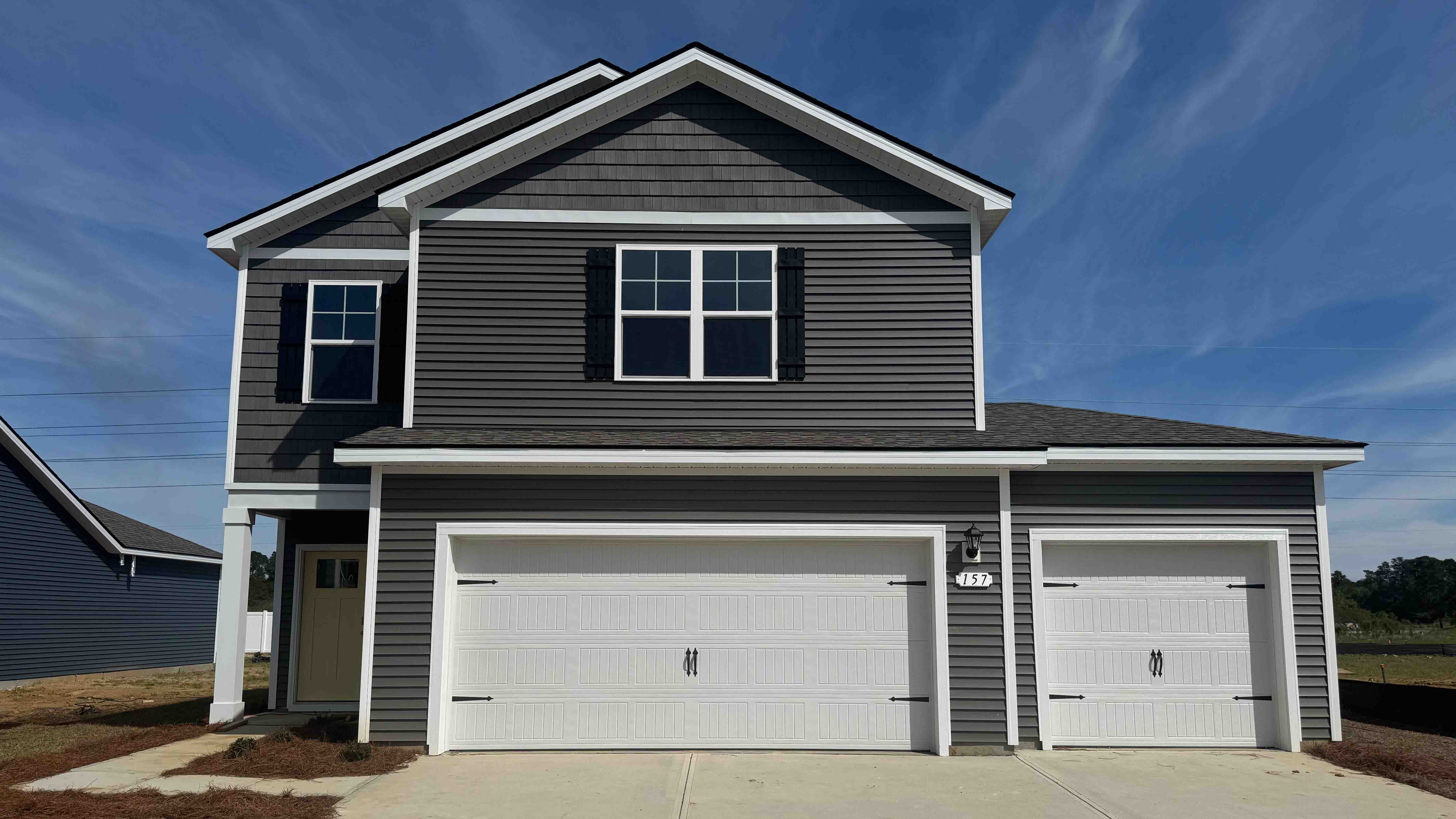 Two story home with three-car garage