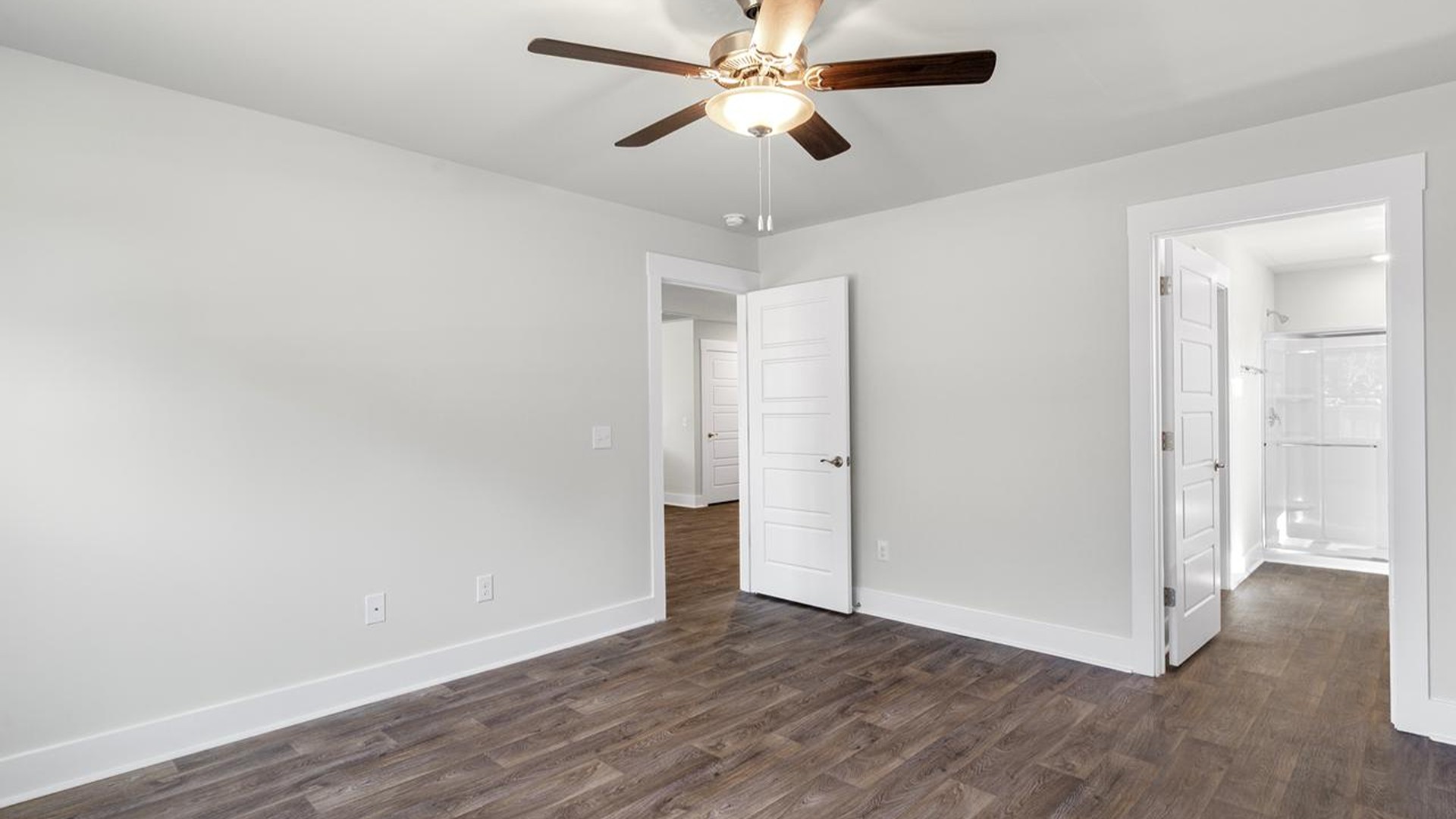 At the back, the Primary Suite provides privacy with a large walk-in closet and walk-in shower. At the back, the Primary Suite provides privacy with a large walk-in closet and walk-in shower.